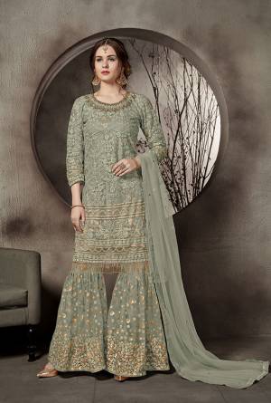This Summer Is About Subtle Shades And Pastel Play, Grab This Heavy Designer Sharara Suit In Pastel Green Color. This Pretty Suit Is Net Based. Its Top And Bottom Are Beautified With Heavy Tone To Tone Embroidery Which Gives A Heavy Rich And Subtle Look To Your Personality. Buy Now.