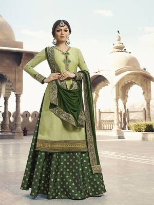 Beautiful Shades In Green Are Here With This Designer Indo-Western Suit In Light Green Colored Top Paired With Dark Green Colored Bottom And Dupatta. Its Top Is Fabricated On Satin Georgette Paired With Brocade Bottom And Chiffon Fabricated Dupatta. Buy This Suit Now.