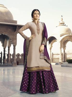 Simple And Elegant Looking Designer Indo-Western Suit Is Here In Beige Color Paired With Purple Colored Bottom And Dupatta. Its Embroidered Top Is Fabricated On Satin Georgette Paired With Brocade Bottom And Chiffon Fabricated Dupatta. It IS Top And Dupatta are Beaitified With Elegant Work.
