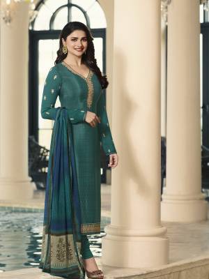 Add This New Shade To Your Wardrobe With This Designer Straight Suit In Teal Green Color Paired With Teal Green And Blue Colored Dupatta. Its Top And Bottom Are Fabricated On Crepe Paired With Chiffon Fabricated Dupatta. It Has Pretty Embroidery Over The Top.