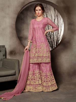 Look Pretty In This Designer Heavy Embroidered Sharara Suit In All Over Pink Color. Its Top, Bottom And Dupatta Are Fabricated On Net Beautified With Heavy Jari Embroidery And Stone Work. Buy This Pretty Suit Now.