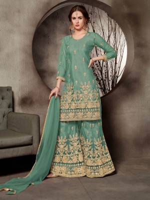 Look Pretty In This Designer Heavy Embroidered Sharara Suit In All Over Sea Green Color. Its Top, Bottom And Dupatta Are Fabricated On Net Beautified With Heavy Jari Embroidery And Stone Work. Buy This Pretty Suit Now.