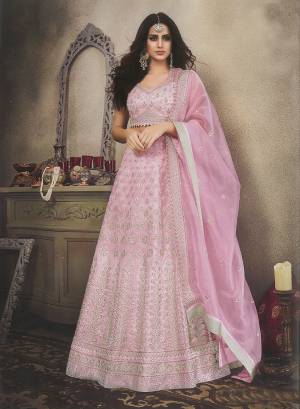 Look Pretty In This Heavy Designer Lehenga Choli In Powder Pink Color. This Lehenga Choli Is Fabricated On Orgenza Beautified With Attractive Embroidery All Over. Also It Is Light In Weight And Easy To Carry Throughout The Gala. 