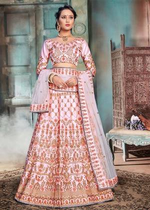 Look Pretty In This Heavy Designer Lehenga Choli In All Over Baby Pink Color. This Pretty Heavy Embroidered Lehenga Choli Is Fabricated On Nylon Satin Paired With Net Fabricated Dupatta. Its Fabrics Are Soft Towards Skin Which Ensures Superb Comfort All Day Long. 
