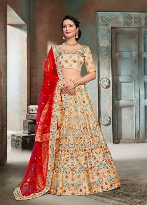 Evergreen Traditional Combination Is Here With This Heavy Designer Lehenga Choli In Beige Color Paired With Contrasting Red Colored Dupatta. This Lehenga Choli Is Fabricated On Nylon Silk Beautified With Heavy Embroidery Paired With Net Fabricated Dupatta. Buy Now.