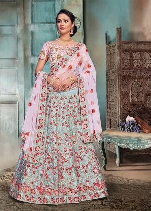 Summer Is All About Pastels. So Grab This Heavy Embroidered Designer Lehenga Choli In Baby Pink Colored Blouse And Dupatta Paired With Contrasting Aqua Blue Colored Lehenga. This Lehenga Choli Is Fabricated On Nylon Satin Paired With Net Fabricated Dupatta. 