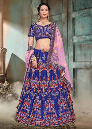 Bright And Visually Appealing Color Is Here With This Heavy Designer Lehenga Choli In Riyal Blue Color Paired With Contrasting Powder Pink Colored Dupatta. This Lehenga And Choli Are Fabricated On Nylon Satin Paired With Net Fabricated Dupatta. Buy This Now.