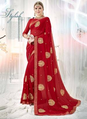 Adorn The Pretty Angelic Look In This Attractive Designer Saree In Red Color Paired With Red Colored Blouse. This Saree And Blouse are Fabricated On Georgette Beautified with Attractive Embroidered Butti All Over.