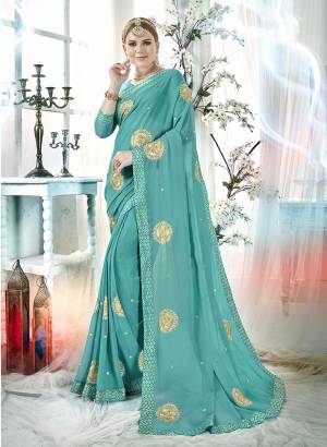 Here Is A Beautiful Designer Saree In Turquoise Blue Color Paired With Turquoise Blue Colored Blouse. This Saree And Blouse Are Fabricated On Georgette Beautified With Embroidered Butti All Over. Buy This Saree Now.