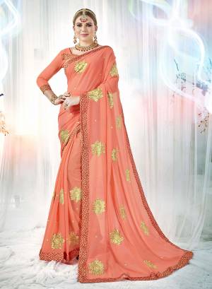 A Must Have Shade In Every Womens Wardrobe Is Here With This Designer Saree In Dark Peach Color Paired With Dark Peach Colored Blouse. This Saree And Blouse are Georgette Based Beautified with Embroidered Butti All Over. Buy This Rich Looking Saree Now.