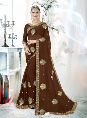 Enhance Your Personality In This Designer Butti Embroidered Designer Saree In Brown Color Paired With Brown Colored Blouse. This Saree And Blouse are Fabricated On Georgette Beautified With Attractive Embroidery All Over. Buy Now.