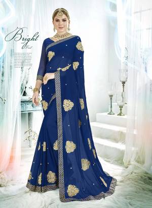 Here Is A Beautiful Designer Saree In Royal Blue Color Paired With Royal Blue Colored Blouse. This Saree And Blouse Are Fabricated On Georgette Beautified With Embroidered Butti All Over. Buy This Saree Now.