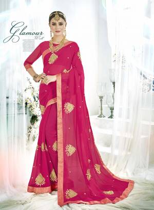 A Must Have Shade In Every Womens Wardrobe Is Here With This Designer Saree In Dark Pink Color Paired With Dark Pink Colored Blouse. This Saree And Blouse are Georgette Based Beautified with Embroidered Butti All Over. Buy This Rich Looking Saree Now.