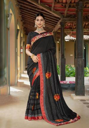 For A Bold And Beautiful Look, Grab This Designer Saree In Black Color Paired With Black Colored Blouse. This Saree And Blouse are Silk Based Beautified With Multi Colored Floral Patch Work And Embroidery. Buy This Designer Saree Now.