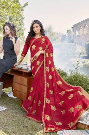 Adorn The Pretty Angelic Look Wearing This Designer Saree In Red Color Paired With Red Colored Blouse. This Saree Is Fabricated On Georgette Paired With Art Silk Fabricated Blouse. It Is Beautified With Attractive Embroidered Butti Work All Over It. 