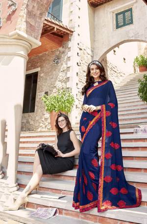 Enhance Your Personality Wearing This Attractive Designer Saree In Blue Color Paired With Blue Colored Blouse. This Pretty Butti Embroidered Saree Is Georgette Based Paired With Art Silk Fabricated Blouse.