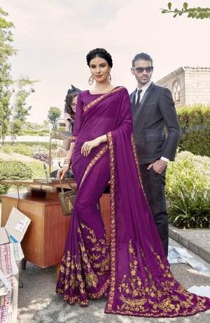 Adorn The Pretty Angelic Look Wearing This Designer Saree In Purple Color Paired With Purple Colored Blouse. This Saree Is Fabricated On Georgette Paired With Art Silk Fabricated Blouse. It Is Beautified With Attractive Embroidey All Over It. 