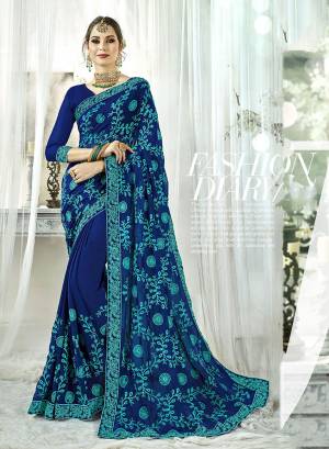 Celebrate This Festive Season With Beauty And Comfort Wearing This Designer Saree In Royal Blue Color. This Saree And Blouse Are Fabricated On Georgette Beautified With Contrasting Resham Embroidery All Over. Buy Now.