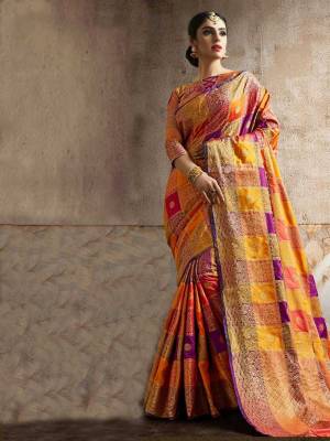 Go Colorful With This Designer Silk Based Saree In Multi Color Paired With Orange Colored Blouse. This Saree And Blouse Are Fabricated On Art Silk beautified With Attractive Weave In Checks Pattern. Buy Now.