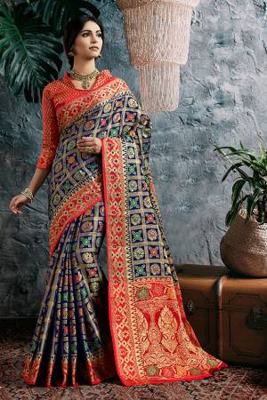 Celebrate This Festive With Beauty And Comfort Wearing This Designer Heavy Weaved Saree In Navy Blue Color Paired With Contrasting Red Colored Blouse. This Saree And Blouse Are Fabricated On Art Silk Beautified With Weave All Over. 