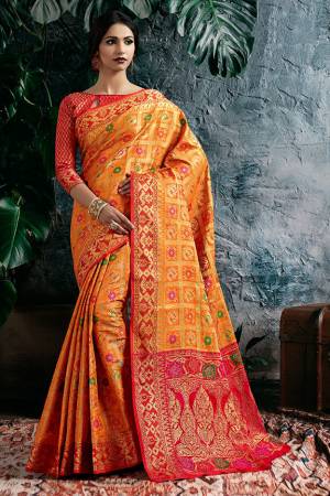 Celebrate This Festive With Beauty And Comfort Wearing This Designer Heavy Weaved Saree In Orange Color Paired With Contrasting Red Colored Blouse. This Saree And Blouse Are Fabricated On Art Silk Beautified With Weave All Over. 