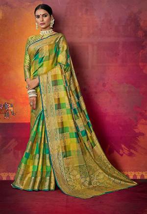Go Colorful With This Designer Silk Based Saree In Green And Yellow Color Paired With Green Colored Blouse. This Saree And Blouse Are Fabricated On Art Silk beautified With Attractive Weave In Checks Pattern. Buy Now.