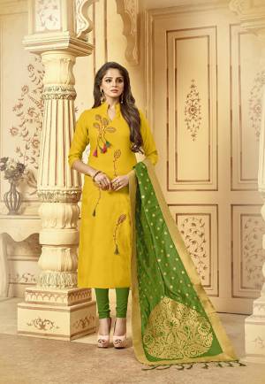 Celebrate This Festive Season With Beauty And Comfort Wearing This Designer Straight Suit In Yellow Colored Top Paired With Contrasting Green Colored Bottom And Dupatta. This Pretty Dress Material Is Cotton Based Paired With Banarasi Jacquard Dupatta. Get This Stitched As Per Your Desired Fit And comfort. 