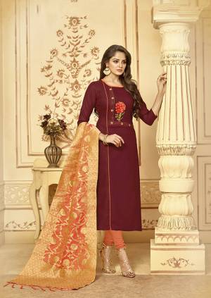 For A Royal And Attractive Look, Grab This Designer Straight Suit In Maroon Colored Top Paired With Contrasting Dark Peach Colored Bottom And Dupatta. This Dress Material Is Cotton Based Paired With Banarasi Jacquard Dupatta. Bu y This Now.