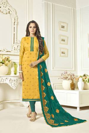 Celebrate This Festive Season With Beauty And Comfort With This Dress, Get This Stitched As Per Your Desired Fit And Comfort. Its Top Is In Yellow Color Paired With Contrasting Teal Green Colored Bottom And Dupatta. Its Top Is Fabricated On Soft Banarasi Jacquard Paired With Cotton Bottom And Chiffon Fabricated Embroidered Dupatta. 