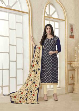 Enhance Your Persoanlity Wearing This Designer Straight Suit In Navy Blue Colored Top Paired With Cream Colored Bottom And Dupatta. It Top Is Fabricated On Soft Banarasi Jacquard Paired With Cotton Bottom And Chiffon Fabricated Dupatta. Buy This Dress Material Now.