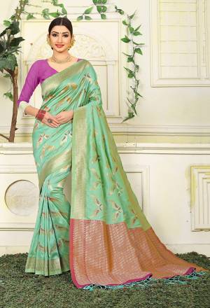Grab This Very Pretty Designer Silk Based Saree In Light Green Color Paired With Contrasting Magenta Pink Colored Blouse. This Saree Is Fabricated On Jacquard Silk Paired With Art Silk Fabricated Blouse Beautified With Weave All Over. 