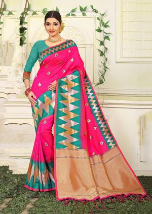 Bright And Visually Appealing Color Is Here With This Designer Silk Based Saree In Fuschia Pink Color Paired With Contrasting Sea Green Colored Blouse. This Saree Is Jacquard Silk Based Beautified With Heavy Weave Paired With Art Silk Fabricated Blouse. 