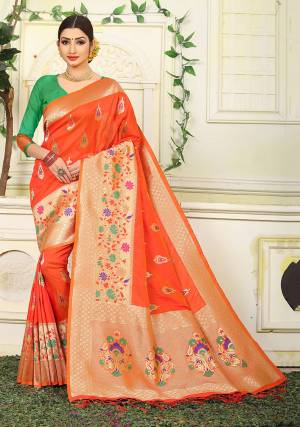 Here Is Proper Traditional Color Pallete With This Designer Silk Based Saree In Orange Color Paired With Contrasting Green Colored Blouse. This Saree Is Fabricated On Jacquard Silk Paired With Art Silk Fabricated Blouse. 