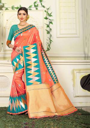 Here Is Proper Traditional Color Pallete With This Designer Silk Based Saree In Orange Color Paired With Contrasting Turquoise Blue Colored Blouse. This Saree Is Fabricated On Jacquard Silk Paired With Art Silk Fabricated Blouse. 