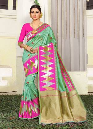 Grab This Very Pretty Designer Silk Based Saree In Light Green Color Paired With Contrasting Rani Pink Colored Blouse. This Saree Is Fabricated On Jacquard Silk Paired With Art Silk Fabricated Blouse Beautified With Weave All Over. 