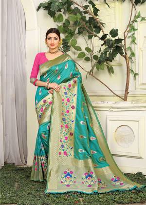 Look Pretty In This Pretty Cool Color Pallete With This Designer Silk Based Saree In Turquoise Blue Color Paired With Contrasting Pink Colored Blouse. This Saree IS Jacquard Silk Based With Heavy Weave Paired With Art Silk Fabricated Blouse. Buy Now.