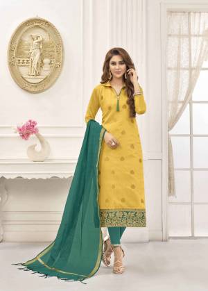 Celebrate This Festive Season With Beauty And Comfort Wearing This Cotton Based Dress Material In Yellow Color Paired With Contrasting Teal Green Colored Bottom And Dupatta. Its Dupatta Is Fabricated On Art Silk. Buy This Suit Now.