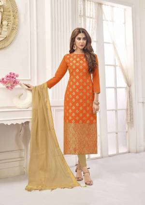 For A Bold And Beautiful Look, Grab This Pretty Dress Material In Orange Color Paired With Beige Colored Bottom And Dupatta. This Dress Material Is Cotton Based Paired With Art Silk Dupatta, Get This Stitched As Per Your Desired Fit And Comfort. 