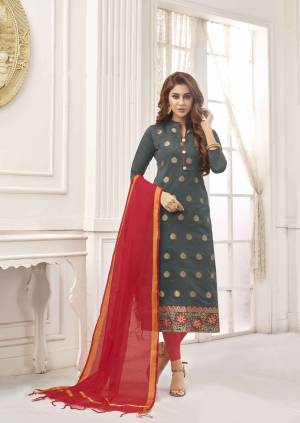 Shine Bright Wearing This Straight Suit In Dark Grey Color Paired With Contrasting Red Colored Bottom And Dupatta. Its Top Is Fabricated On Cotton Slub Paired With Cotton Bottom And Art Silk Fabricated Dupatta. Buy This Dress Material Now.