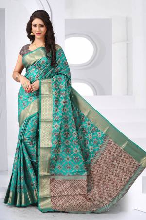 Grab This Beautiful Designer Silk Based Saree Which Gives A Rich Look To Your Personality. This Saree Is Fabricated On Patola Jacquard Silk Paired With Art Silk Fabricated Blouse, Beautified With Weave 
