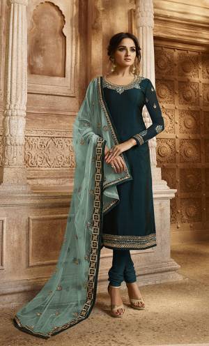 Go With The Pretty Shades Of Blue With This Designer Two In One Indo-Western Suit. Its Top And Bottom Are In Dark Teal Blue Color Paired With Sky Blue Colored Lehenga And Dupatta.  Its Top Is Fabricated On Satin Georgette Paired With Santoon Bottom And Net Fabricated Embroidered Lehenga And Dupatta. Buy Now.