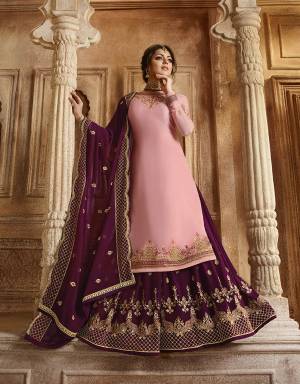 Look Pretty In This Lovely Designer Piece Which You can Wear In Two Ways As It Comes With A Bottom And Lehenga. Its Top And Bottom Are In Pink Color Paired With Dark Megenta Pink Colored Lehenga And Dupatta. Its Top Is Fabricated On Satin Georgette Paired With Santoon Bottom And Georgette Fabricated Lehenga And Dupatta. Buy This Semi-Stitched Suit Now.