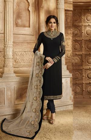 For A Bold And Beautiful Look, Grab This Designer Indo-Western Suit Which You Can Wear Two Ways. Its Top And Bottom are In Black Color Paired With Pale Grey Colored Lehenga And Dupatta. Its Top Is Fabricated On Satin Georgette Paired With Santoon Bottom And Net Fabricated Lehenga And Dupatta. All Its Fabrics Are Light Weight And Easy To Carry Throughout The Gala. 