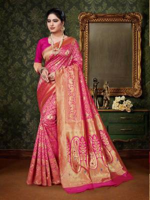 Celebrate This Festive Season With A Pure Traditional Touch Wearing This Designer Silk Based Saree In Rani Pink Color. This Saree And Blouse Are Fabricated On Art Silk Beautified With Weave All Over. Buy This Designer Saree Now.