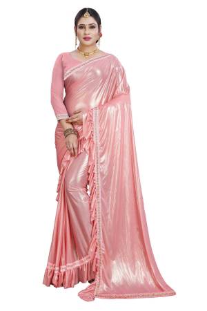 Look Pretty In This Designer Pink Colored Saree Paired With Pink Colored Blouse. This Saree Is Lycra Based Paired With Satin Silk Fabricated Blouse. Its Main Attraction Is Its Ruffles And Lace Border With Plain And Elegant Saree. 
