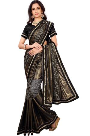 For A Bold And Beautiful Look Grab This Unqiue Colored Designer Saree In Copper Paired With Black Colored Blouse. This Saree Is Fabricated On Lycra Paired With Art Silk Fabricated Blouse. Buy This Rich Designer Saree Now.