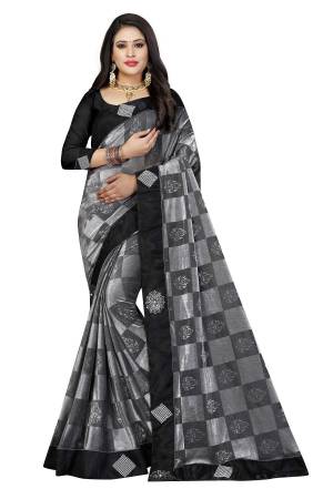Must Have Shade In Every Womens Wardrobe Is Here With This Designer Checkred Saree In Grey Color Paired With Black Colored Blouse. This Saree Is Fabricated On Lycra Paired With Art Silk Fabricated Blouse. Buy Now.