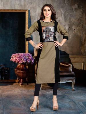 Grab This Beautiful Readymade Kurti For Your Casual Or Semi-Casual Wear, This Kurti Is Fabricated On Rayon Beautified With Printed Patch And Buttons. Buy Now.