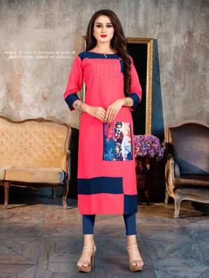 Beat The Heat This Summer With This Readymade Light Weight Kurti Fabricated On Rayon. This Kurti Is Beautified With Printed Patch And Buttons. Buy Now.