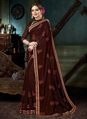 Enhance Your Personality Wearing This Designer Saree In Brown Color Paired With Brown Colored Blouse, This Butti Embroidered Saree Is Fabricated On Georgette Paired with Art Silk Fabricated Blouse. 